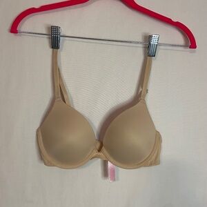 Victoria Secret "Pink" Bra 32A. Tan with pink fabric lining the cups. Never worn